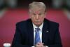 FILE - In this Tuesday, July 7, 2020 file photo, President Donald Trump listens during a 