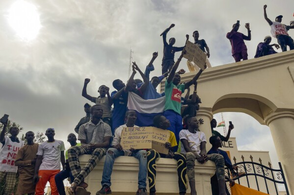 FILE - Supporters of Niger's ruling junta gather at the start of a protest called to fight for the country's freedom and push back against foreign interference in Niamey, Niger, Aug. 3, 2023. As several European countries evacuate Niger, the Biden administration is showing itself unusually intent on staying. It sees Niger as the United States' last, best counterterrorism outpost — and until the coup, a promising democracy — in a region plagued by instability. (AP Photo/Sam Mednick, File)