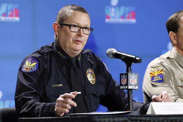 FILE - Michael Sullivan, the interim police chief for the Phoenix Police Department, speaks a news conference, Feb. 7, 2023, in Phoenix. On Thursday, Jan. 11, 2024, the city of Phoenix asked the U.S. Department of Justice to end its two-year civil rights investigation of the city’s police department through an agreement in which it would take recommendations for changes from the federal agency but wouldn’t be subject to costly court supervision. (AP Photo/Gregory Payan, File)