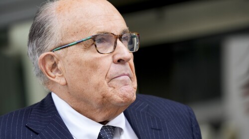 FILE - Rudy Giuliani speaks with reporters as he departs the federal courthouse, May 19, 2023, in Washington. Giuliani is not disputing that he publicly made statements about two Georgia election workers that were defamatory and false, but he contends they were constitutionally protected statements, according to a statement filed in court. (AP Photo/Patrick Semansky, File)
