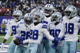 Cowboys acarician boleto para los playoffs