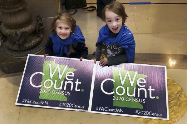 FILE - In this April 1, 2019, photo, Noelle Fries, 6, left, and Galen Biel, 6, both of Minneapolis, attend a rally at the Minnesota Capitol to kick off a year-long drive to try to ensure that all Minnesota residents are counted in the 2020 census. Around 1 in 20 residents in Arkansas and Tennessee were missed during the 2020 census. Other U.S. states, including Minnesota, had significant overcounts of their populations, according to figures the U.S. Census Bureau released Thursday, May 19, 2022. (AP Photo/Steve Karnowski, File)