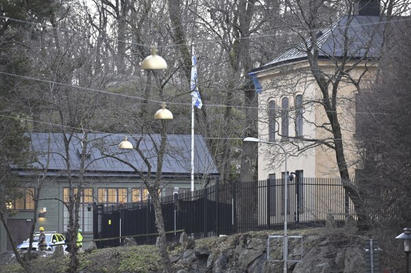 FILE - Officers stand near the Israeli Embassy in Stockholm, Sweden, Wednesday, Jan. 31, 2024. Sweden say it has noticed that Iran is increasingly beginning to target the interests of other states in Sweden, with which it is in conflict with and Tehran is using criminal networks in the Scandinavian country. Earlier this year, the Israeli Embassy in Stockholm was sealed off after what was then described as “a dangerous object” was found at the diplomatic mission. (Henrik Montgomery/TT News Agency via AP, File)