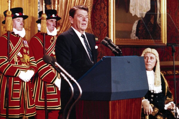 FILE - President Ronald Reagan, during a brief visit to London, June 8, 1982, makes his address to Britain's Houses of Parliament, in the Royal Gallery of the Palace of Westminster. As most Republican White House hopefuls gather Wednesday at Reagan’s presidential library for a debate, expect to hear more homages to the “Great Communicator.” (AP Photo/Ron Edmonds, File)