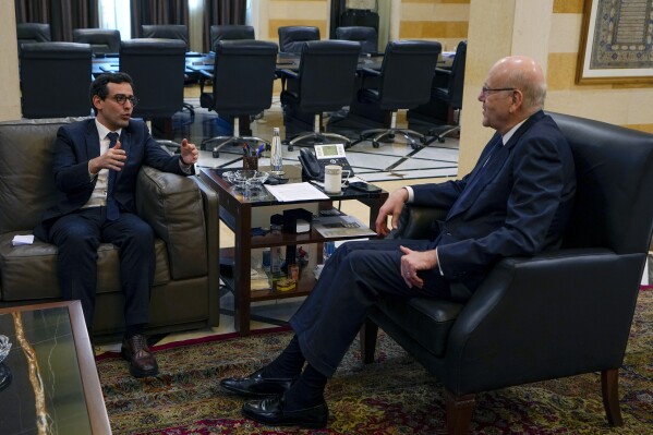 French Foreign Minister Stephane Sejourne, left, meets with Lebanese caretaker Prime Minister Najib Mikati in Beirut, Lebanon, Tuesday, Feb. 6, 2024. Sejourne arrived in Beirut earlier in the day on an official visit to discuss the situation in the Middle East and tensions along the Lebanon-Israel border. (AP Photo/Bilal Hussein)