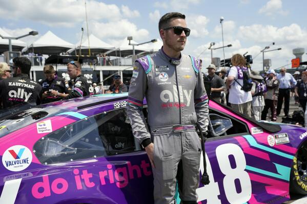 FILE - Alex Bowman waits for the start of a NASCAR Cup Series auto race on June 20, 2021, in Lebanon, Tenn. Bowman felt he underperformed last year when NASCAR brought the Cup Series back to the Nashville area for the first time in 37 years.  He's now seeking a stronger showing Sunday, June 26, 2022. (AP Photo/Mark Humphrey, File)