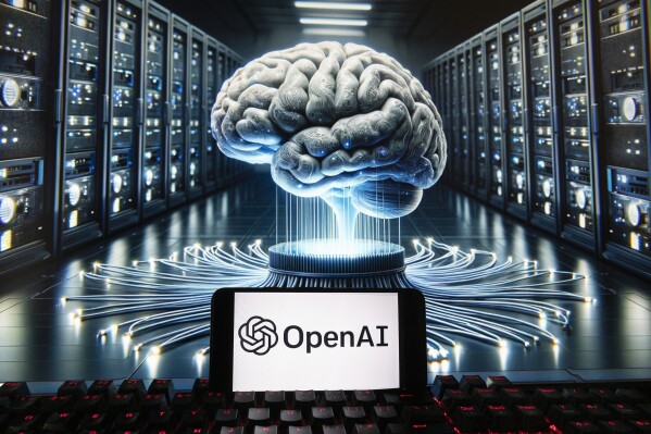 FILE - The OpenAI logo is seen displayed on a cell phone with an image on a computer monitor generated by ChatGPT's Dall-E text-to-image model, Dec. 8, 2023, in Boston. A group of OpenAI's current and former workers is calling on the ChatGPT-maker and other artificial intelligence companies to protect whistleblowing employees who flag safety risks about AI technology.(AP Photo/Michael Dwyer, File)