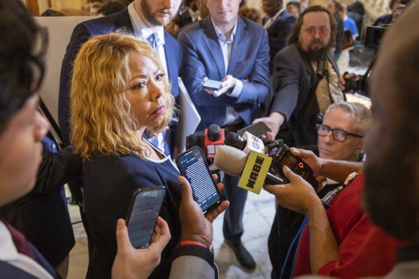 U.S. Rep. Lucy McBath, D-Ga 7th District, speaks to journalists after signing paperwork to qualify for reelection at the Capitol in Atlanta on Monday, March 4, 2024, the first day to file paperwork to qualify for legislative and congressional races. (Arvin Temkar/Atlanta Journal-Constitution via AP)