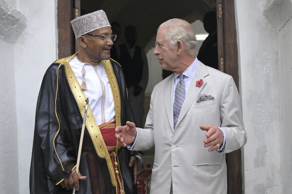 Britain's King Charles III, right, speaks with Chairperson of the Mandhry Mosque Committee Babu Ali Said during a visit to Al-Mandhry at Mahandry Mosque in Mombasa, Kenya, Friday Nov. 3, 2023. (Simon Maina/Pool via AP)