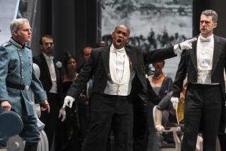 This image released by Opera Philadelphia shows, from left, tenor Toffer Mihalka, tenor Lawrence Brownlee and bass-baritone Christian Pursell during a performance of "Otello." (Steven Pisano/Opera Philadelphia via AP)