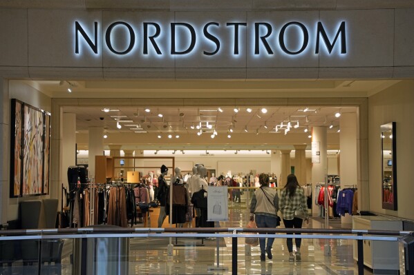 FILE - This photo shows the entrance to a Nordstrom store, Jan. 30, 2023, in Pittsburgh. On Thursday, Aug. 24, Nordstrom reported that its sales and profits fell in its fiscal second quarter, joining its department store peers coping with shoppers' cautious spending. (AP Photo/Gene J. Puskar, File)