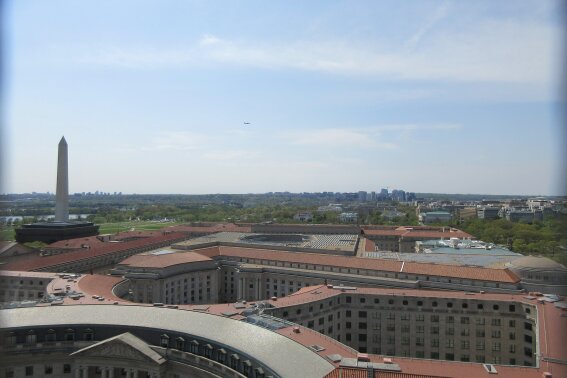 This April 13, 2017 photo shows the view of the Washington Monument from the clock tower atop the Trump International Hotel in Washington D.C. in the historic Old Post Office building. (AP Photo/Beth J. Harpaz)

