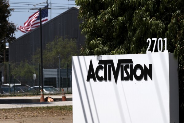 FILE - A sign outside the Activision building in Santa Monica, Calif., June 21, 2023. Microsoft revamped its bid to buy video game maker Activision Blizzard on Tuesday Aug. 22, 2023, to appease British competition regulators, who are the last major hurdle to closing one of the biggest deals in tech history. (AP Photo/Richard Vogel, File)