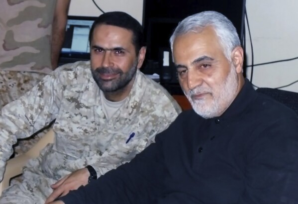 This undated picture released by Hezbollah Military Media, shows senior Hezbollah commander Wissam Tawil, left, who was killed in Kherbet Selem village, south Lebanon, on Monday, Jan. 8, 2024, sitting next of slain Iran's Quds force General Qassem Soleimani, who was killed in Baghdad by a U.S. drone strike in January 2020. An Israeli airstrike killed Tawil, who is an elite Hezbollah commander in southern Lebanon, the latest in an escalating exchange of strikes along the border that have raised fears of another Mideast war even as the fighting in Gaza exacts a mounting toll on civilians.(Hezbollah Military Media, via AP)