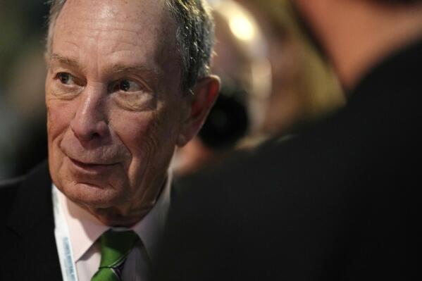 FILE - U.S. businessman Michael Bloomberg speaks with participants prior to a meeting with Earthshot prize winners and finalists at the Glasgow Science Center in Glasgow, Scotland, Tuesday, Nov. 2, 2021. Bloomberg will spend $120 million in an effort to reduce the soaring numbers of deaths from drug overdoses, he announced Wednesday, Nov. 10, 2021 at a healthcare summit he organized. The pledge more than doubles the $50-million philanthropic commitment he made toward the same goal in 2018. (AP Photo/Alastair Grant, Pool)