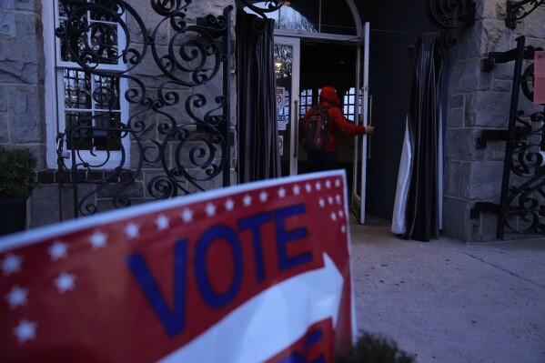 A voter enters a polling site for the Presidential primary election on Tuesday, March 12, 2024, in Atlanta. (AP Photo/Brynn Anderson)