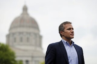 FILE - In this May 17, 2018 file photo, Missouri Gov. Eric Greitens looks on before speaking at an event near the capitol in Jefferson City, Mo. Greitens, a sometimes brash outsider whose unconventional resume as a Rhodes Scholar and Navy SEAL officer made him a rising star in Republican politics, abruptly announced his resignation Tuesday, May 29, 2018, after a scandal involving an affair with his former hairdresser led to a broader investigation by prosecutors and state legislators. (AP Photo/Jeff Roberson, File)