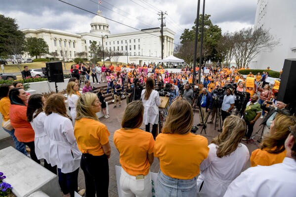 FILE - Hundreds gather for a protest rally for in vitro fertilization legislation Wednesday, Feb. 28, 2024, in Montgomery, Ala. Alabama lawmakers, who face public pressure to get in vitro fertilization services restarted, are nearing approval of immunity legislation to shield providers from the fall out of a court ruling that equated frozen embryos to children. Legislative committees on Tuesday, March 5, will debate the bills that would protect clinics from lawsuits and criminal prosecution for the “damage or death of an embryo” during IVF services. (Mickey Welsh/The Montgomery Advertiser via AP, File)