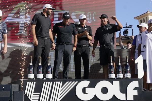From left to right, Dustin Johnson, Patrick Reed, Talor Gooch and Pat Perez celebrate after the 4 Aces GC won the LIV Golf Team Championship at Trump National Doral Golf Club, Sunday, Oct. 30, 2022, in Doral, Fla. (AP Photo/Lynne Sladky)
