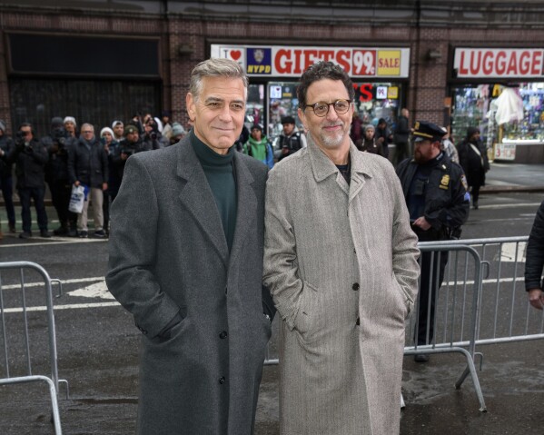 George Clooney, left, and Grant Heslov appear at the "Good Night, and Good Luck" Broadway cast announcement at the Winter Garden Theatre on Feb. 6, 2025, in New York. (Photo by Christopher Smith/Invision/AP, File)