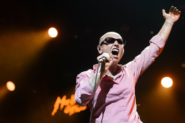 FILE - Irish singer Sinead O'Connor performs on the Stravinski Hall stage at the 49th Montreux Jazz Festival, in Montreux, Switzerland on July 4, 2015. O’Connor, the gifted Irish singer-songwriter who became a superstar in her mid-20s but was known as much for her private struggles and provocative actions as for her fierce and expressive music, has died at 56. The singer's family issued a statement reported Wednesday by the BBC and RTE. (Jean-Christophe Bott/Keystone via AP, File)