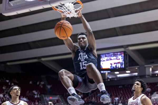 FILE - Texas A&M forward Henry Coleman III (15) dunks against Alabama during the second half of an NCAA college basketball game Wednesday, March 2, 2022, in Tuscaloosa, Ala. Coleman is the team’s top returning scorer after averaging 11 points a game last season. (AP Photo/Vasha Hunt, File)