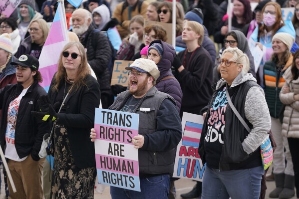 FILE -People gather in support of transgender youth during a rally at the Utah State Capitol Tuesday, Jan. 24, 2023, in Salt Lake City. New laws targeting LGBTQ+ people are proliferating in GOP-led states, but often absent from policy decisions is a clear understanding of how many people will be directly affected. (AP Photo/Rick Bowmer,File)