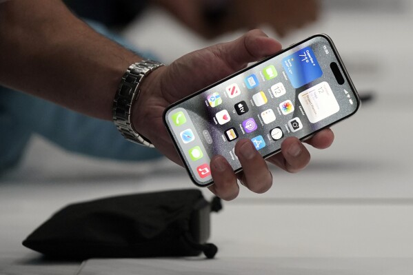 The iPhone 15 Pro is shown after its introduction on the Apple campus, Tuesday, Sept. 12, 2023, in Cupertino, Calif. (AP Photo/Jeff Chiu)