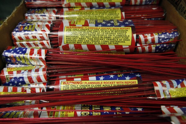 FILE - In a May 24, 2012 file photo, bottle rockets are shown at Southgate Fireworks in Southgate, Mich. A year-and-a-half after legalizing louder, more powerful fireworks in Michigan, lawmakers are close to giving local governments the power to restrict their use around holidays after a slew of complaints were lodged by the public. A 2011 law lets cities, townships and villages pass their own rules concerning the ignition, discharge and use of consumer-grade fireworks. But it prohibits the ordinances from applying on or near a national holiday. (AP Photo/Paul Sancya, file)