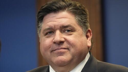 FILE - Illinois Gov. J.B. Pritzker smiles during a bill signing ceremony Monday, March 13, 2023, in Chicago. Illinois Gov. J.B. Pritzker on Friday, June 9, 2023, signed into law two measures aimed at safeguarding the rights of LGBTQ+ people as other states move to restrict the community, just days after the Human Rights Campaign declared a state of emergency for LGBTQ+ people in the U.S. (AP Photo/Charles Rex Arbogast, File)