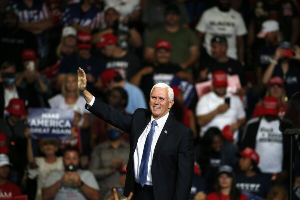 Vice President Mike Pence waves to the crowd during a campaign rally in Tulsa, Okla., Saturday, June 20, 2020. (AP Photo/Sue Ogrocki)