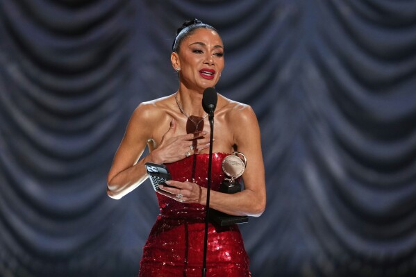Nicole Scherzinger accepts the award for best performance by an actress in a leading role in a musical for "Sunset Blvd." during the 78th Tony Awards on Sunday, June 8, 2025, at Radio City Music Hall in New York. (Photo by Charles Sykes/Invision/AP)