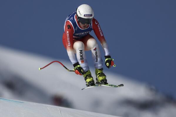 Switzerland's Jasmine Flury speeds down the course on her way to win the alpine ski, women's World Championship downhill, in Meribel, France, Saturday, Feb. 11, 2023. (AP Photo/Gabriele Facciotti)