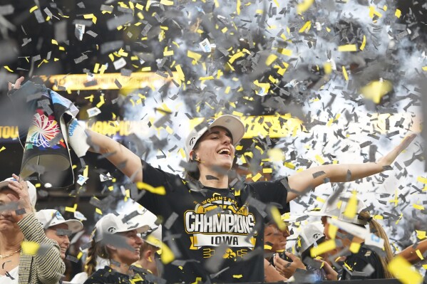Iowa guard Caitlin Clark celebrates after the overtime win of an NCAA college basketball game against Nebraska in the final of the Big Ten women's tournament, Sunday, March 10, 2024, in Minneapolis. (AP Photo/Abbie Parr)