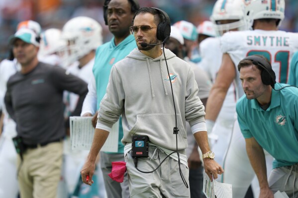 Miami Dolphins head coach Mike McDaniel walks the sidelines during the second half of an NFL football game against the Denver Broncos, Sunday, Sept. 24, 2023, in Miami Gardens, Fla. (AP Photo/Rebecca Blackwell)