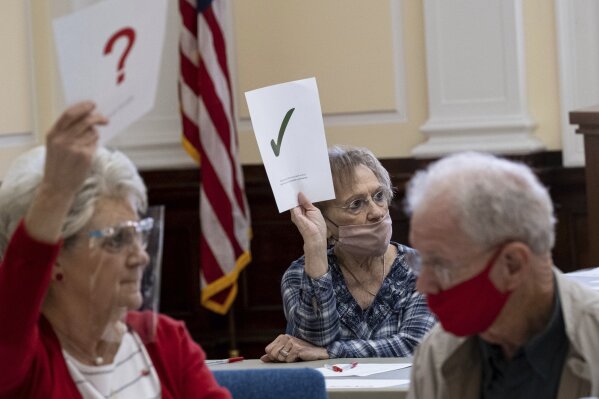 Officials sort ballots during an audit at the Floyd County administration building in Rome, Ga., on Friday morning, Nov. 13, 2020. Election officials in Georgia’s 159 counties are undertaking a hand tally of the presidential race that stems from an audit required by state law. (AP Photo/Ben Gray)