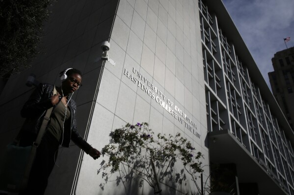 A pedestrian passes by the main building of the University of California Hastings College of the Law on Feb. 10, 2015, in San Francisco. A judge on Tuesday, Feb. 6, 2024, threw out a lawsuit that sought to block the university from renaming the former Hastings College of the Law because its namesake was linked to the slaughter of Native Americans (Mike Kepka/San Francisco Chronicle via AP)