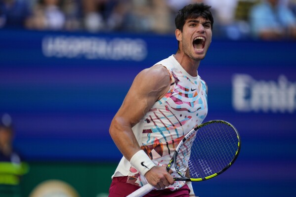 Carlos Alcaraz, of Spain, reacts during a match against Daniel Evans, of the United Kingdom, during the third round of the U.S. Open tennis championships, Saturday, Sept. 2, 2023, in New York. (AP Photo/Manu Fernandez)