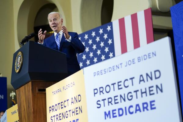 FILE - President Joe Biden speaks about his administration's plans to protect Social Security and Medicare and lower healthcare costs, Feb. 9, 2023, at the University of Tampa in Tampa, Fla. Social Security and Medicare, the financial safety nets millions of older Americans rely on and millions of young people are counting on, will run short on funds to pay full benefits within the next decade, a new annual report released Friday warns. (AP Photo/Patrick Semansky, File)