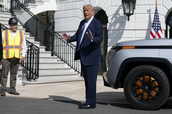 President Donald Trump talks to reporters after viewing the Endurance all-electric pickup truck, made in Lordstown, Ohio, at the White House, Monday, Sept. 28, 2020, in Washington. (AP Photo/Evan Vucci)