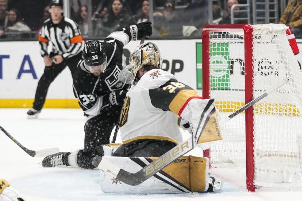 Vegas Golden Knights goaltender Logan Thompson (36) stops a shot by Los Angeles Kings' Viktor Arvidsson (33) during the second period of an NHL hockey game Tuesday, Dec. 27, 2022, in Los Angeles. (AP Photo/Jae C. Hong)