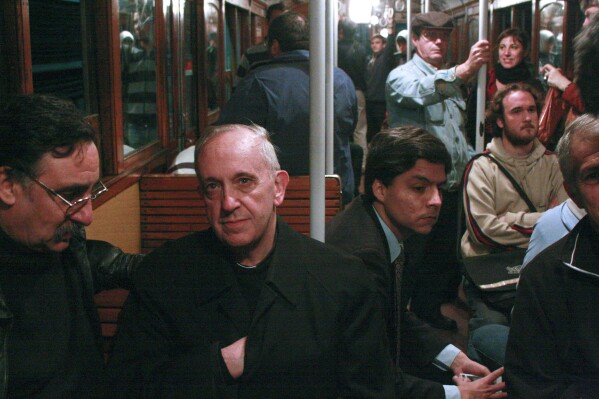 In this 2008 file photo, Cardinal Jorge Mario Bergoglio, second from left, travels on the subway in Buenos Aires, Argentina in this 2008 file photo. (AP Photo/Pablo Leguizamon, File)