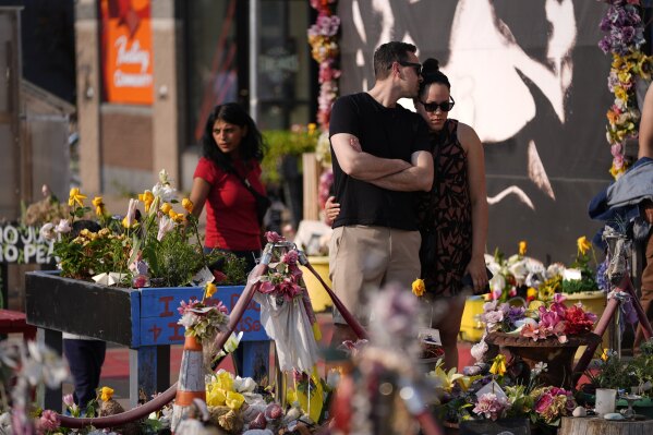People visit George Floyd Square on the five-year anniversary of Floyd's death, Sunday, May 25, 2025, in Minneapolis. (AP Photo/Abbie Parr)