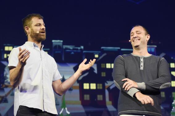 FILE - "South Park" creators Matt Stone, left, and Trey Parker discuss the "South Park: The Fractured But Whole" video game onstage at Ubisoft's E3 2015 Conference at the Orpheum Theatre on June 15, 2015, in Los Angeles. Warner Bros. Discovery Inc. is suing Paramount Global, saying its competitor aired new episodes of the popular animated comedy series "South Park" after Warner paid for exclusive rights. (Photo by Chris Pizzello/Invision/AP, File)