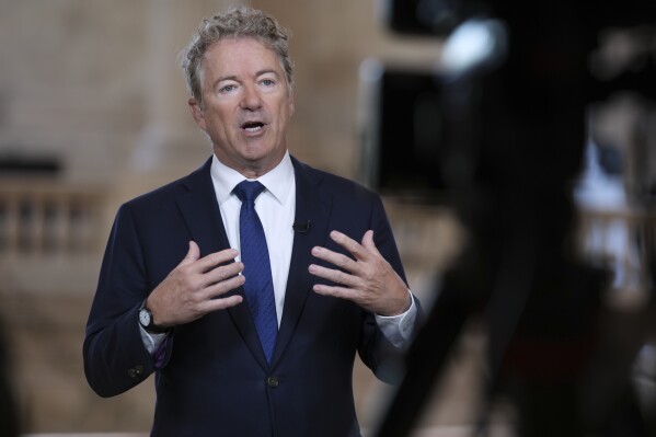 As Senate Republicans work to advance President Donald Trump's spending and tax bill, Sen. Rand Paul, R-Ky., who is opposed to the reconciliation package because of the debt-limit increase, does a TV news interview at the Capitol in Washington, Tuesday, June 3, 2025. (AP Photo/J. Scott Applewhite)