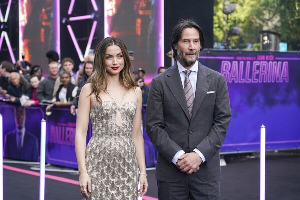 Ana de Armas, left, and Keanu Reeves pose for photographers upon arrival at World premiere of the film 'Ballerina' in London, Thursday, May 22, 2025. (Photo by Alberto Pezzali/Invision/AP)