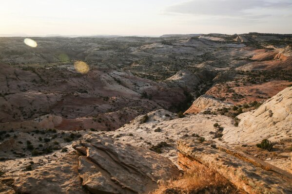 FILE - This July 9, 2017 file photo, shows a view of Grand Staircase-Escalante National Monument in Utah. A government watchdog will investigate whether the U.S. Interior Department broke the law by making plans to open up lands cut from the Utah national monument by President Trump to leasing for oil, gas and coal development. U.S. Sen. Tom Udall of New Mexico said Monday, June 17, 2019, in a news release that the Government Accountability Office informed his office last week that it has agreed to his request that it look into whether the Interior violated the appropriations law by using funds to assess potential resource extraction in the lands cut from the Grand Staircase-Escalante National Monument. (Spenser Heaps/The Deseret News via AP, File)