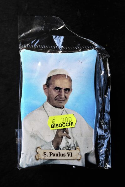 A religious souvenir depicting Pope Paul VI in Rome, Thursday, May 1, 2025. (AP Photo/Bernat Armangue)