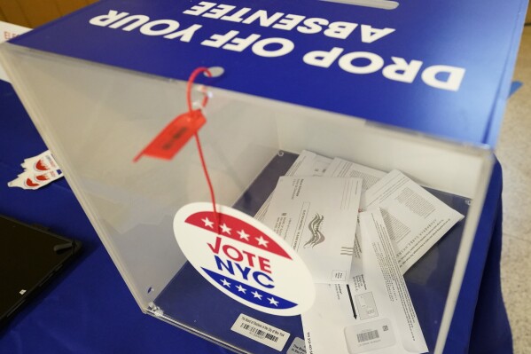 FILE - Absentee ballots sit inside a sealed ballot box during early voting in the primary election, June 14, 2023, in the SoHo neighborhood of New York. New York voters will decide of a variety of races and ballot questions in Tuesday's general election. At stake are seats for the New York City Council and state Supreme Court as well as races for county executive posts across the state. Voters will also decide two statewide ballot measures dealing with state debt limit requirements. (AP Photo/Mary Altaffer, File)