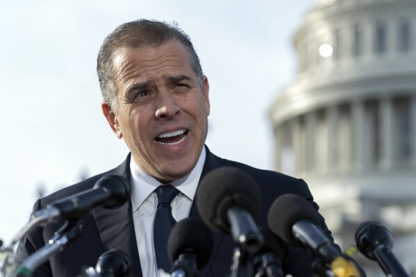 FILE - Hunter Biden, son of President Joe Biden, talks to reporters at the U.S. Capitol, in Washington, Dec. 13, 2023. Hunter Biden has again asked a judge to dismiss the federal gun case against him, arguing it is politically motivated and key evidence was tested after charges were filed. (AP Photo/Jose Luis Magana. File)